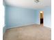 Bright bedroom with neutral carpet and calming blue walls at 1148 Bannockburn Ave, Rock Hill, SC 29732