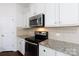 Close-up of kitchen featuring stainless steel appliances and granite countertops at 1148 Bannockburn Ave, Rock Hill, SC 29732