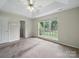 Spacious bedroom with double tray ceilings and large windows at 1148 Stallings Rd, Matthews, NC 28104