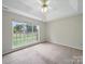Bedroom with plush carpet and large windows at 1148 Stallings Rd, Matthews, NC 28104