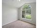 Bedroom featuring a unique arched window at 1148 Stallings Rd, Matthews, NC 28104