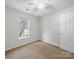 Bedroom with neutral carpet and window with exterior view at 1148 Stallings Rd, Matthews, NC 28104