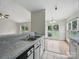 Kitchen with stainless steel sink and adjacent breakfast nook at 1148 Stallings Rd, Matthews, NC 28104