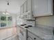 Bright kitchen with white appliances adjacent to eat-in kitchen at 1148 Stallings Rd, Matthews, NC 28104