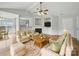 Inviting living room featuring a fireplace, built-in shelving, and seamless flow to the kitchen for modern living at 1148 Stallings Rd, Matthews, NC 28104
