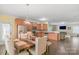 Open-concept dining room with modern light fixture and seamlessly connected kitchen at 1219 Century Dr, Clover, SC 29710