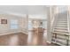 Bright open living room featuring hardwood floors, wainscoting, and a staircase at 1219 Century Dr, Clover, SC 29710