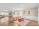 Bright living room features natural light, hardwood floors, comfortable seating, and warm decor at 1219 Century Dr, Clover, SC 29710