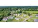 Aerial view of the home showcasing a manicured lawn, garage and circular driveway at 129 Sara Ln, Statesville, NC 28625