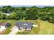 Aerial view of the home showcases a manicured lawn, garage and privacy fence at 129 Sara Ln, Statesville, NC 28625