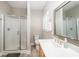 Clean bathroom featuring a glass door shower, modern vanity, and neutral color palette at 129 Sara Ln, Statesville, NC 28625