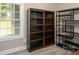 This room showcases hardwood floors, large windows and multiple bookcases offering stylish storage at 129 Sara Ln, Statesville, NC 28625