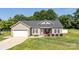 Charming ranch-style home featuring a welcoming front porch, neutral siding, and a well-maintained lawn at 129 Sara Ln, Statesville, NC 28625
