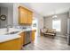 Bright eat-in kitchen featuring stainless steel appliances, light wood cabinetry, and a cozy dining nook at 129 Sara Ln, Statesville, NC 28625