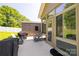 The concrete patio features patio seating and a view of the shed and sunroom at 129 Sara Ln, Statesville, NC 28625