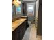 Bathroom with granite countertops, dual sinks, cabinet storage and tub/shower combo at 145 Honeycutt Rd, Salisbury, NC 28144
