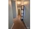 Hallway with carpeted floors, blue walls, and a contemporary-style standing shelf at 145 Honeycutt Rd, Salisbury, NC 28144
