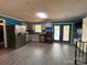 Bright kitchen with stainless steel appliances, light gray cabinets, and an outdoor view from the double patio doors at 145 Honeycutt Rd, Salisbury, NC 28144