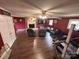Open living area with hardwood floors, a brick fireplace, and a seating area for relaxing at 145 Honeycutt Rd, Salisbury, NC 28144