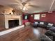 Living area with a fireplace, mounted television, and a comfortable seating area with a sectional sofa at 145 Honeycutt Rd, Salisbury, NC 28144