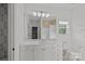 Bright bathroom with double sinks, vanity, and tile flooring offers a luxurious feel at 16909 Red Cow Rd, Charlotte, NC 28277