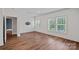Bright, spacious bedroom with hardwood floors and many windows offering lots of natural light at 16909 Red Cow Rd, Charlotte, NC 28277