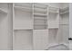 A spacious walk-in closet with shelving, drawers, and hanging rods provides ample storage at 16909 Red Cow Rd, Charlotte, NC 28277