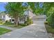 Charming two-story home with a welcoming front porch and attached two-car garage at 16909 Red Cow Rd, Charlotte, NC 28277
