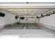 Spacious two-car garage with a checkered floor, ample storage, and room for vehicles at 16909 Red Cow Rd, Charlotte, NC 28277