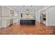 Modern kitchen featuring a large island, stainless steel appliances, and stylish pendant lighting at 16909 Red Cow Rd, Charlotte, NC 28277