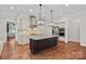 Well-appointed kitchen featuring a large center island, stainless appliances, and sleek cabinetry for a modern feel at 16909 Red Cow Rd, Charlotte, NC 28277