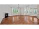 Bright living room with hardwood floors, fireplace, and large windows, perfect for entertaining at 16909 Red Cow Rd, Charlotte, NC 28277