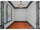 Stylish office featuring a modern chandelier, contrasting trim, and plenty of natural light at 16909 Red Cow Rd, Charlotte, NC 28277