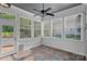 Inviting sunroom with multiple windows and tile floor, perfect for relaxing and enjoying the view at 16909 Red Cow Rd, Charlotte, NC 28277