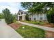 Charming exterior with manicured landscaping, sidewalk, and beautiful architectural details at 1712 Askern Ct, Waxhaw, NC 28173