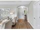 Welcoming foyer featuring hardwood floors, an arched doorway, and natural light at 1712 Askern Ct, Waxhaw, NC 28173