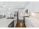 Kitchen boasts stainless steel appliances, ample countertop space, and modern design at 1712 Askern Ct, Waxhaw, NC 28173