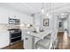 Bright kitchen featuring pendant lighting, granite countertops, and breakfast bar at 1712 Askern Ct, Waxhaw, NC 28173