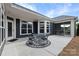 Covered patio with outdoor seating and string lights, perfect for relaxing or entertaining at 1712 Askern Ct, Waxhaw, NC 28173