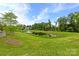 Scenic pond surrounded by lush greenery, offering a serene and peaceful community setting at 1712 Askern Ct, Waxhaw, NC 28173