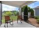 Cozy porch with rocking chairs, offering a relaxing outdoor seating area surrounded by lush greenery and a peaceful ambiance at 1712 Askern Ct, Waxhaw, NC 28173