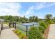 Community tennis courts with black metal fencing and meticulously maintained landscaping at 1712 Askern Ct, Waxhaw, NC 28173