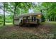 Exterior rear of home showing a deck and wooded backyard at 1802 Deer St, Charlotte, NC 28214