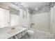 Bathroom with a shower, toilet, and sink with marble countertops at 1802 Deer St, Charlotte, NC 28214
