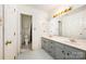 Bathroom with a double sink vanity, mirror and separate toilet and shower room at 1802 Deer St, Charlotte, NC 28214
