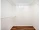 Walk-in closet with wire shelving and wooden floors at 1802 Deer St, Charlotte, NC 28214