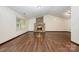 Inviting living room with a brick fireplace, hardwood floors, and a vaulted ceiling at 1802 Deer St, Charlotte, NC 28214