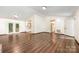 Hardwood floors and a kitchen view enhance the living area, complemented by doors leading to the outside at 1802 Deer St, Charlotte, NC 28214
