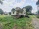 Quaint two-story home with a covered front porch and tidy landscaping at 205 Woods St, Mount Holly, NC 28120