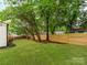 Backyard with privacy fence and mature landscaping at 2114 Thurmond Pl, Charlotte, NC 28205